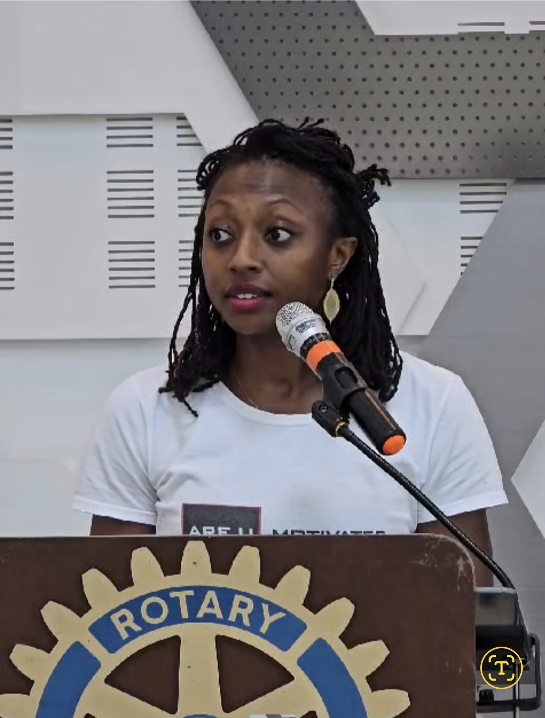 Sarah Livingstone speaking at a podium